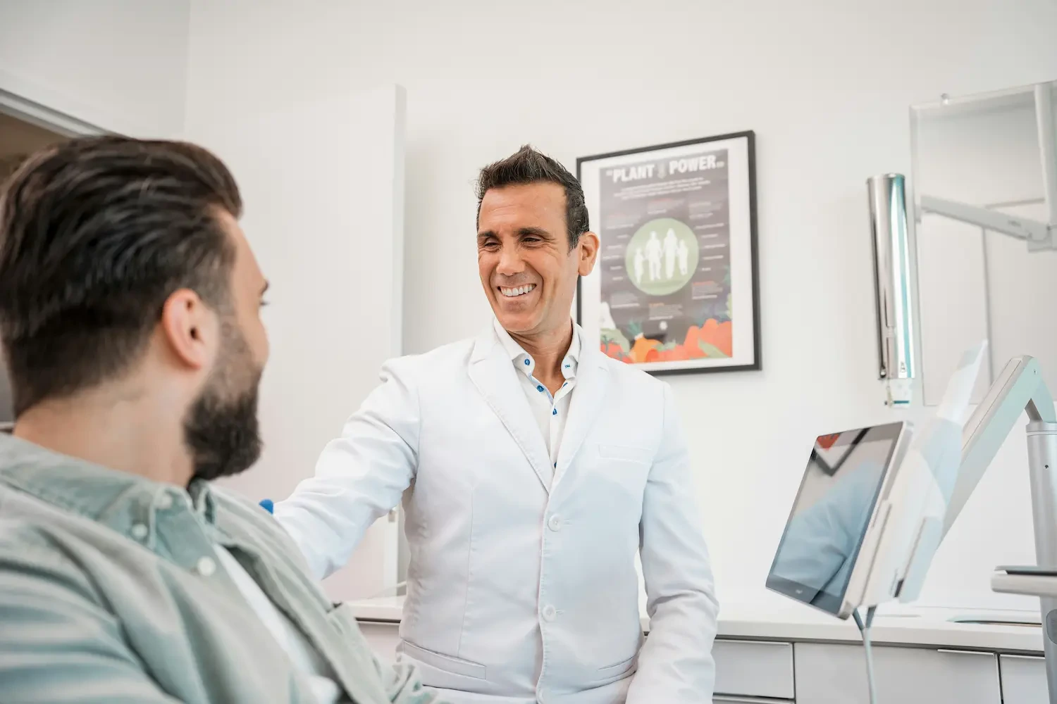 Emergency dentist in Anchorage, KY examining a patient with severe tooth pain during a same-day appointment