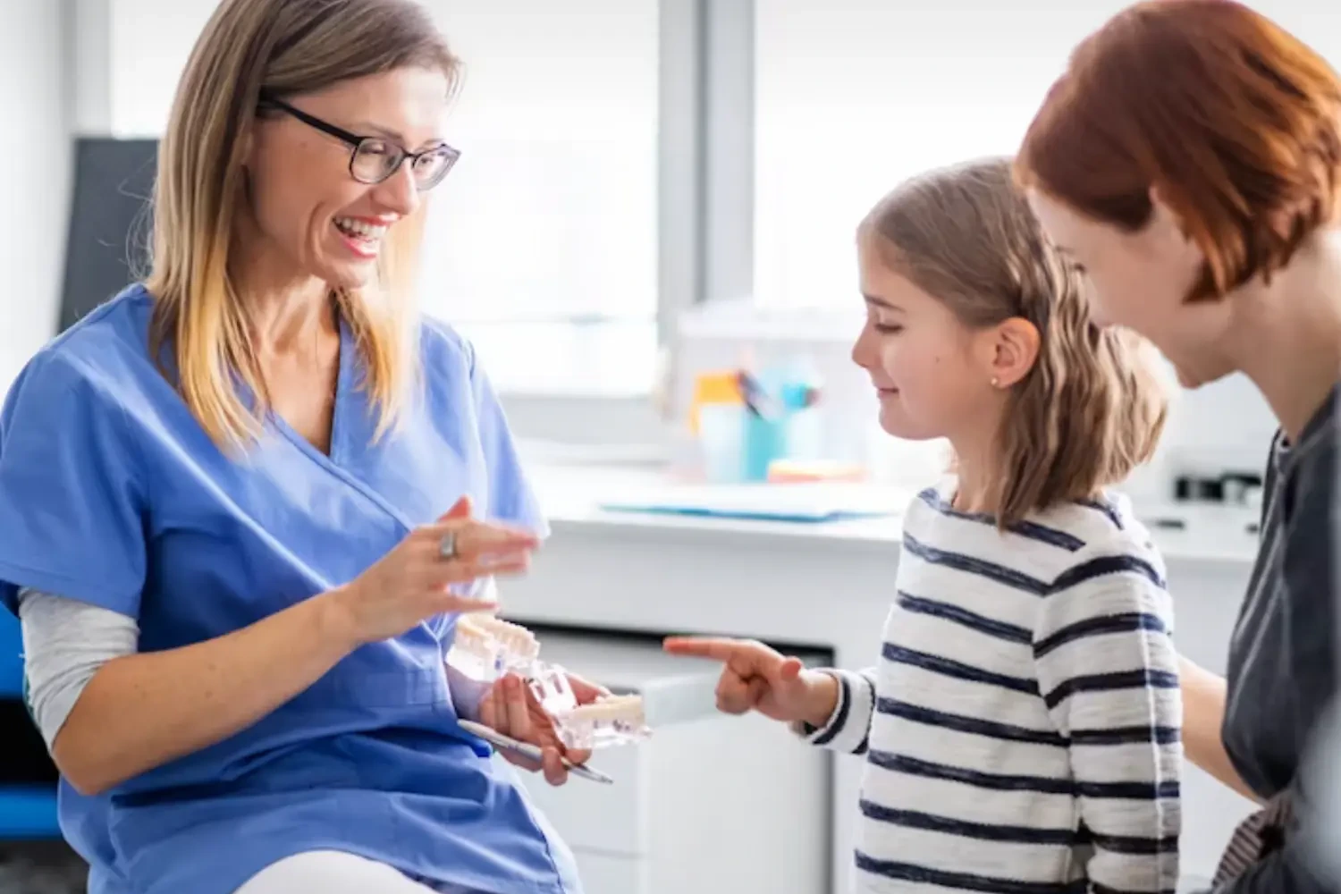 Emergency dentist in Middletown, KY treating a patient with severe tooth pain on a same-day visit